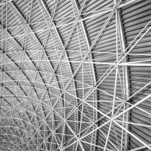 גגות אולמות ספורט Modern interior architecture of metal steel roof structure of airport or industrial factory.